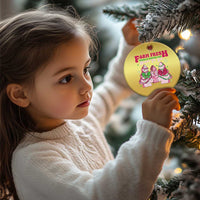 Gold round Christmas ornament held on a tree, featuring Farm Fresh holiday graphic