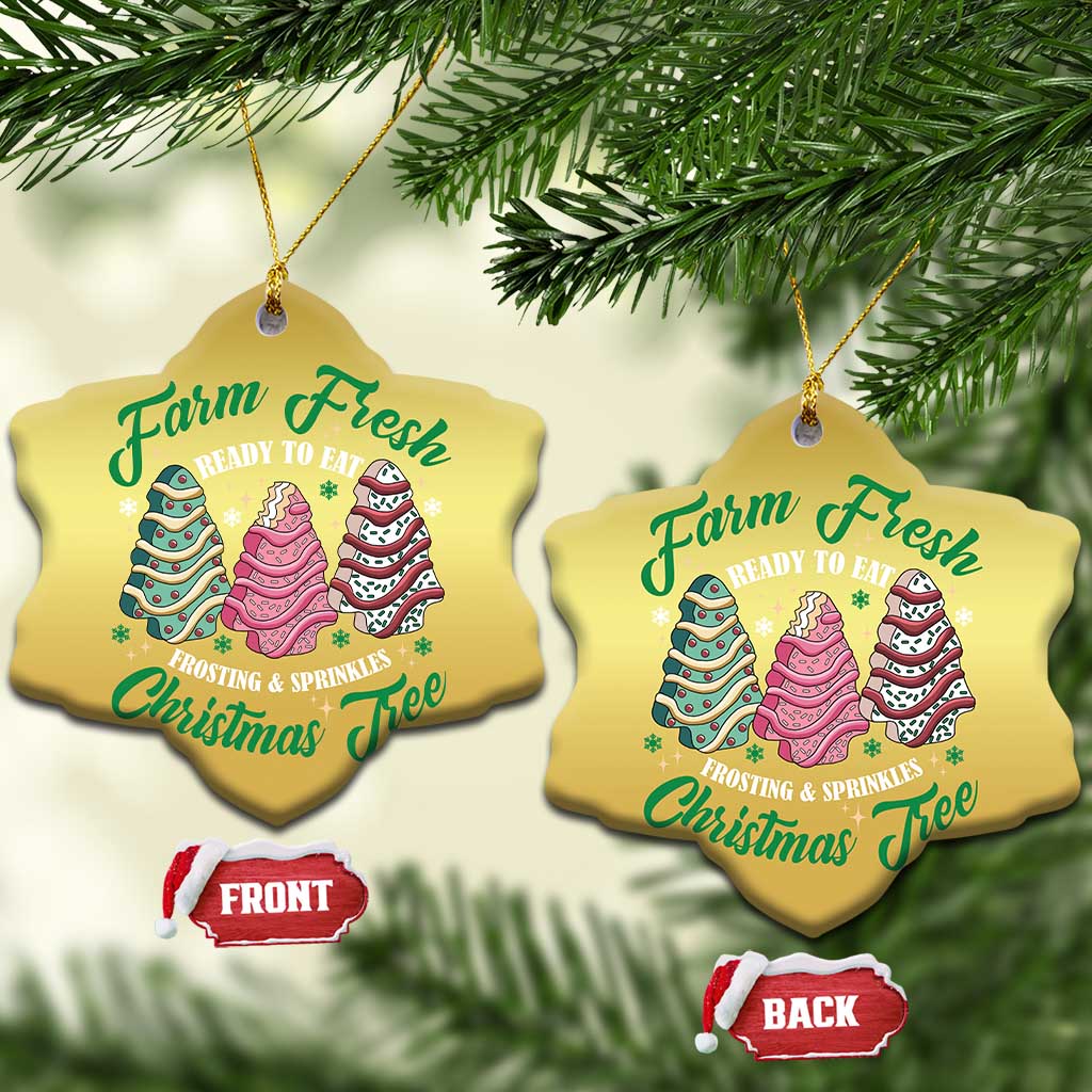 Two gold heart Christmas ornaments with cake tree graphics and gold hanging loops