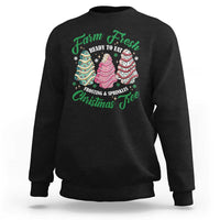 Black sweatshirt with colorful Christmas tree cake graphic and green lettering on back