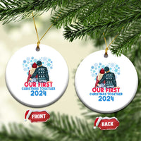 Two white round Christmas ornaments on strings, each with a couple graphic and “Our First Christmas Together 2024”