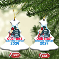 Two white bell-shaped Christmas ornaments with couple graphic and “Our First Christmas Together 2024”