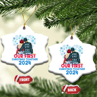 Two white heart-shaped Christmas ornaments with couple graphic and “Our First Christmas Together 2024”
