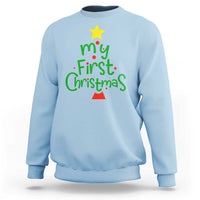 Light blue crewneck sweatshirt with “My First Christmas” graphic and small tree icon