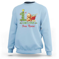 Light blue baby Christmas sweatshirt with gingerbread teddy, tree graphic, and "Your Name" text