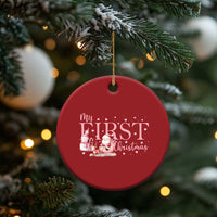 Red round “My FIRST Christmas” ornament with Santa and snowman illustration