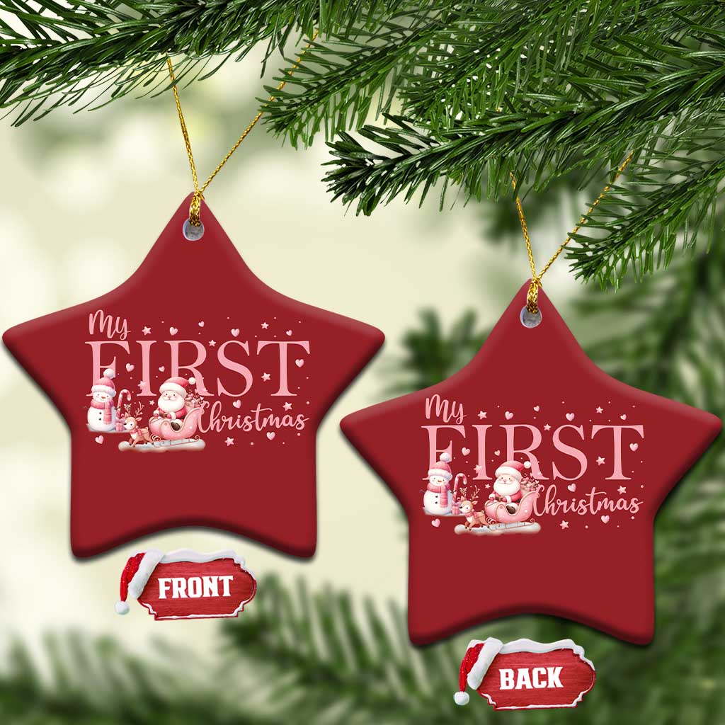 Two red star-shaped “My FIRST Christmas” ornaments hanging from gold strings, front and back