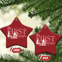 Two red star-shaped “My FIRST Christmas” ornaments hanging from gold strings, front and back