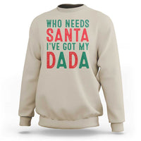 Sand crewneck sweatshirt with 'WHO NEEDS SANTA' and 'I'VE GOT MY DADA' print