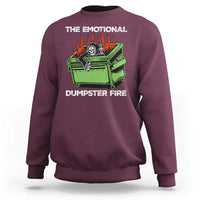 Maroon crewneck sweatshirt with flaming skull dumpster graphic on front.