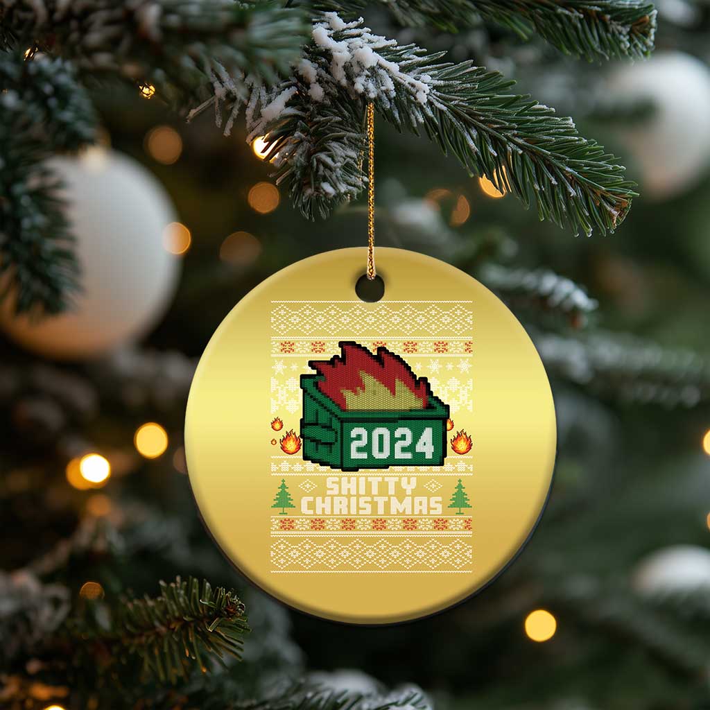 Gold round ornament hanging from a tree branch, with 2024 fire and festive text