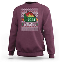 Maroon crewneck sweatshirt with 2024 holiday graphic and Christmas tree design