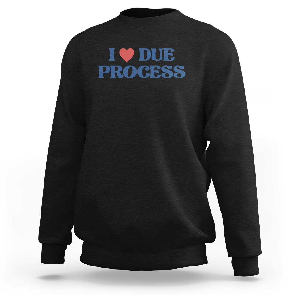 Black crewneck sweatshirt with Due Process heart logo on chest