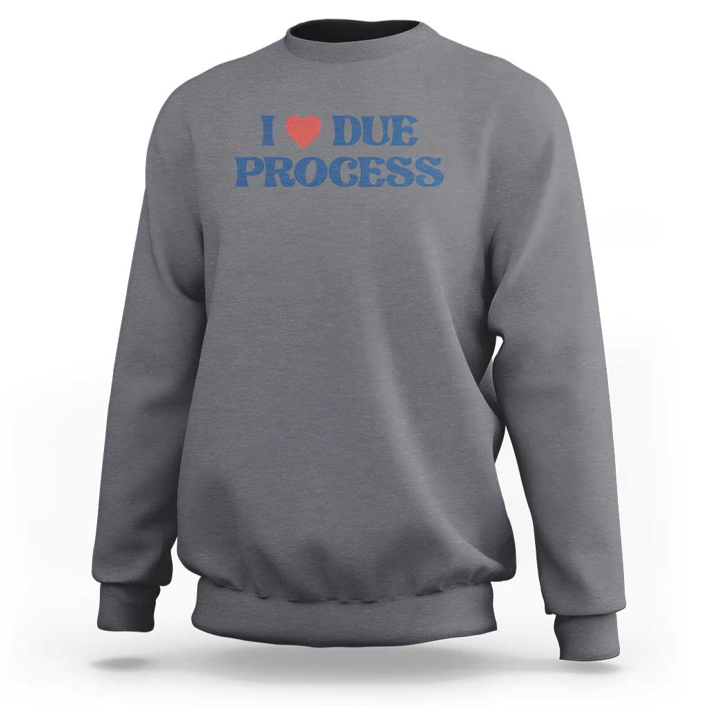 Medium gray crewneck sweatshirt with Due Process heart logo on chest