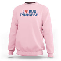 Light pink crewneck sweatshirt with Due Process heart logo on chest