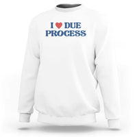 White crewneck sweatshirt with Due Process heart logo on chest