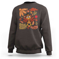 Dark brown sweatshirt with colorful turkey and fall leaf floral graphic