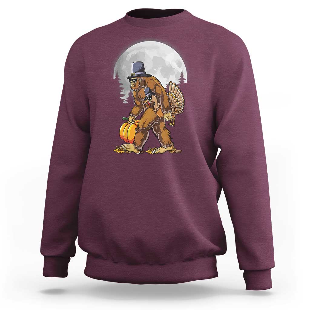 Maroon crewneck sweatshirt with pilgrim-style Bigfoot graphic holding a turkey