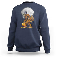 Navy crewneck sweatshirt with pilgrim-style Bigfoot graphic holding a turkey