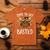Orange short-sleeve crewneck Thanksgiving turkey graphic T-shirt, 'TIME TO GET BASTED'.