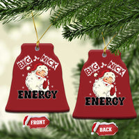 Two red bell-shaped ornaments with Santa “Big Nick Energy,” gold hanging strings