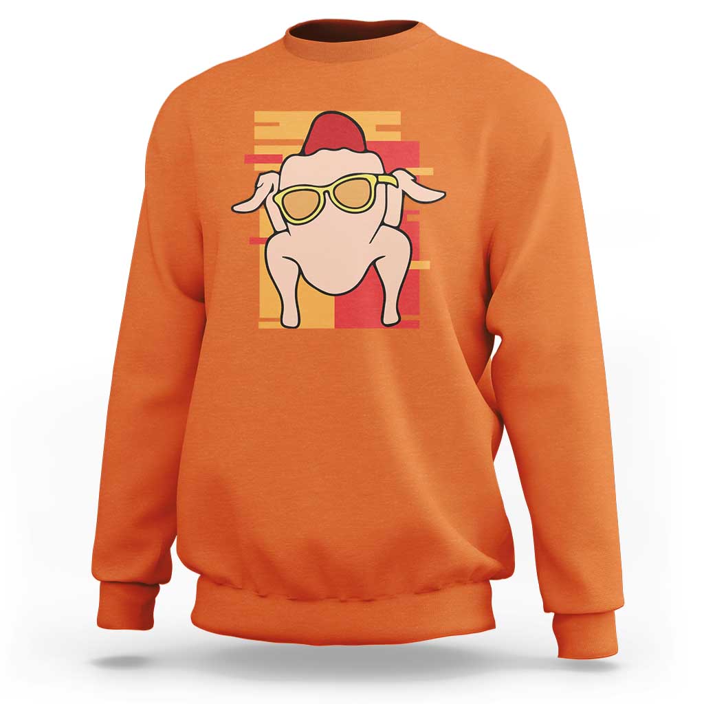 Orange turkey graphic sweatshirt with crew neck and long sleeves