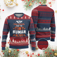 Knitted festive sweatshirt with navy, burgundy, and red fairisle pattern and text graphic