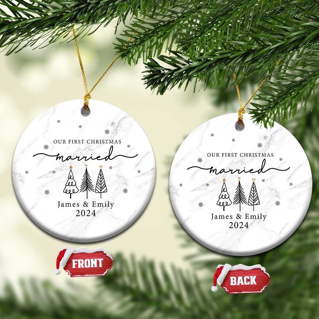 Two white marble round ornaments with 'Our First Christmas married James & Emily 2024'.