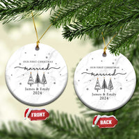 Two white marble round ornaments with 'Our First Christmas married James & Emily 2024'.