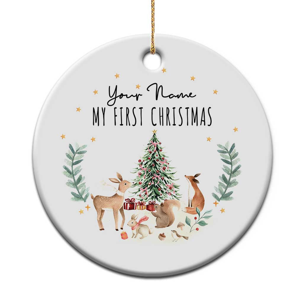 White personalized baby first Christmas circle ornament with deer, tree, and custom name text.