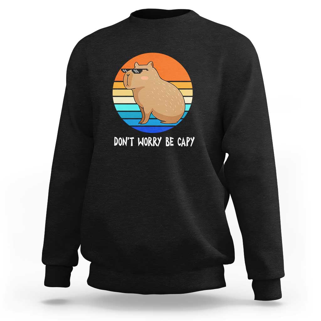 Black capybara graphic sweatshirt with 'DON'T WORRY BE CAPY' text, crew neck long sleeves