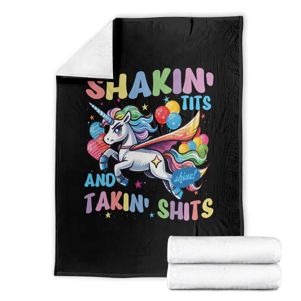Black throw blanket with unicorn and colorful text design, folded with rolled edge
