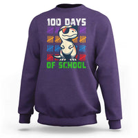 Kids' purple sweatshirt with '100 DAYS OF SCHOOL' and cartoon dinosaur graphic
