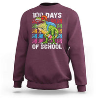 Maroon 100th-day school sweatshirt with dinosaur graphic front