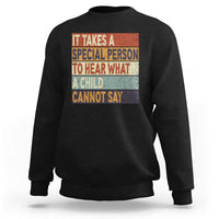 Black sweatshirt with colorful inspirational quote graphic on the front