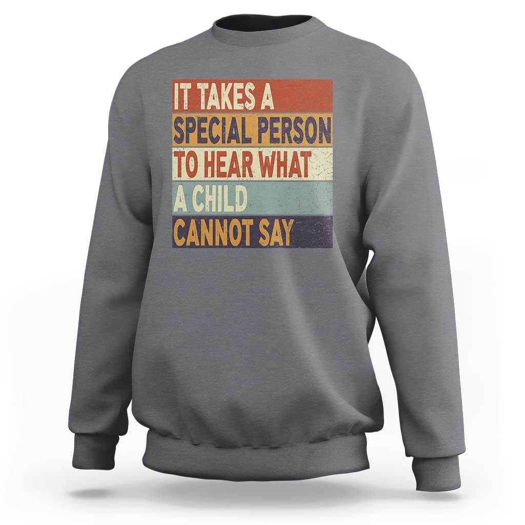 Dark heather gray sweatshirt with colorful inspirational quote graphic on the front