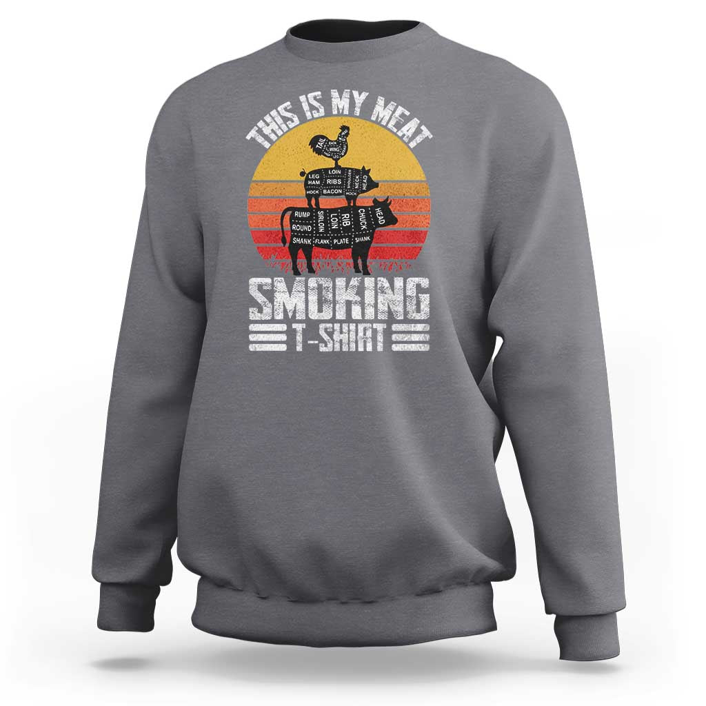 Charcoal gray crewneck sweatshirt with BBQ smoker graphic and “Smoking” text on front