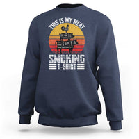 Navy crewneck sweatshirt with BBQ smoker graphic and “Smoking” text on front