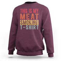 Maroon crewneck sweatshirt with 'THIS IS MY MEAT SMOKING T-SHIRT' graphic