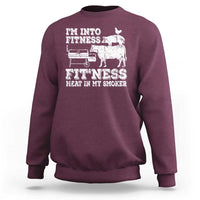Maroon crewneck sweatshirt with front fitness bbq meat-at-smoker graphic