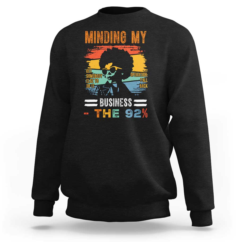 Black crewneck sweatshirt with long sleeves and front graphic print