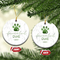Pair of round marble pet memorial ornaments with green paw-heart, DURE, 2024