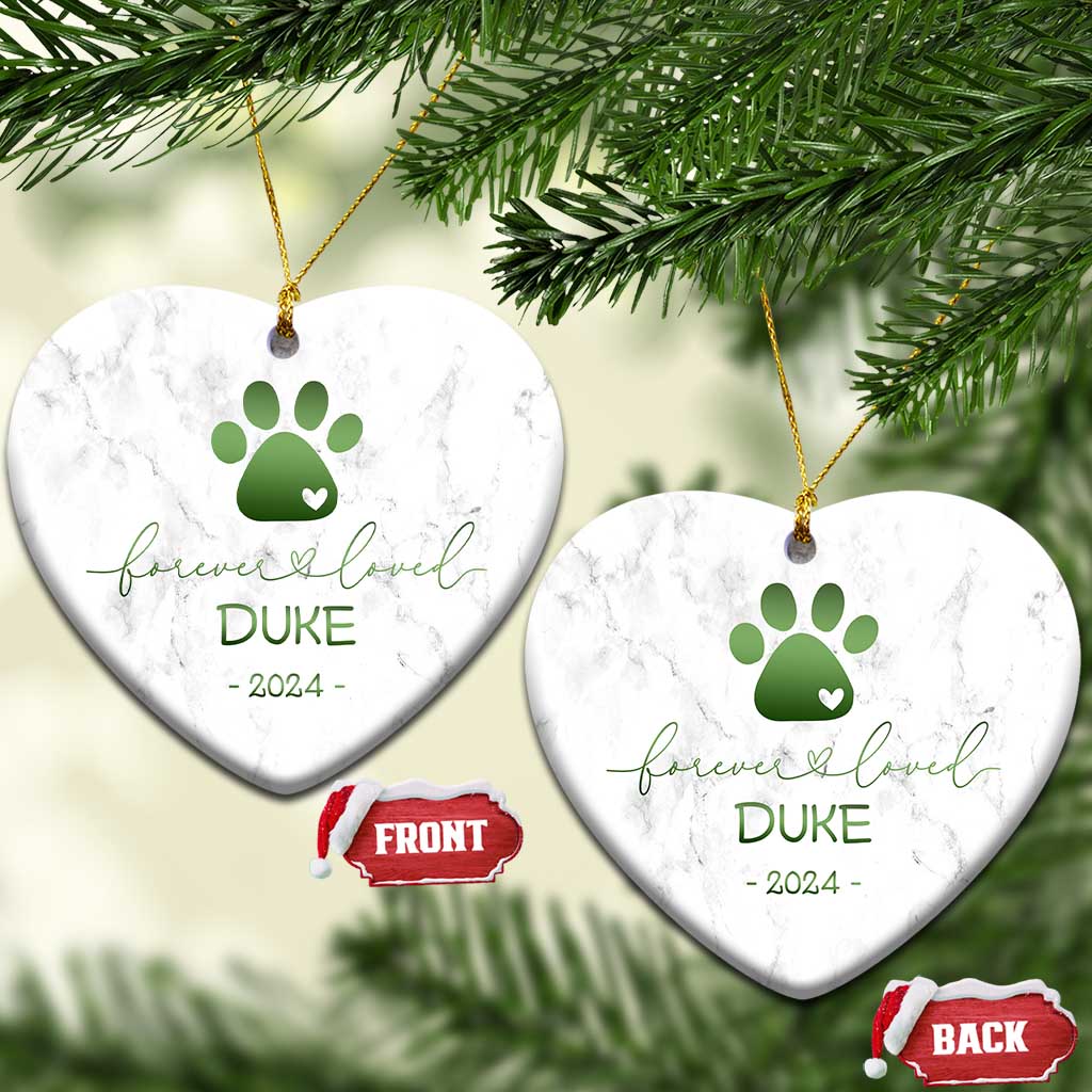 Pair of heart-shaped marble pet memorial ornaments with green paw-heart, DURE, 2024