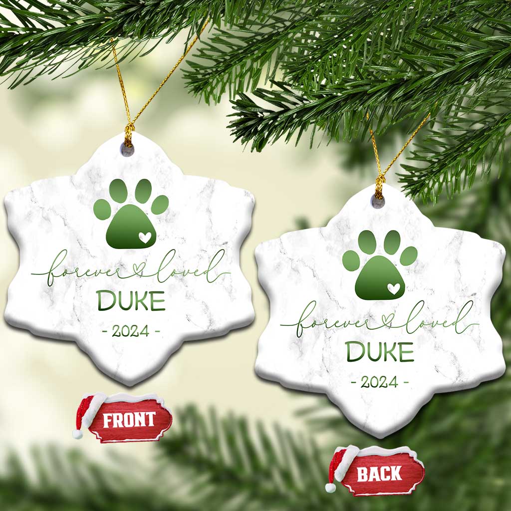 Pair of snowflake-shaped marble pet memorial ornaments with green paw-heart, DURE, 2024