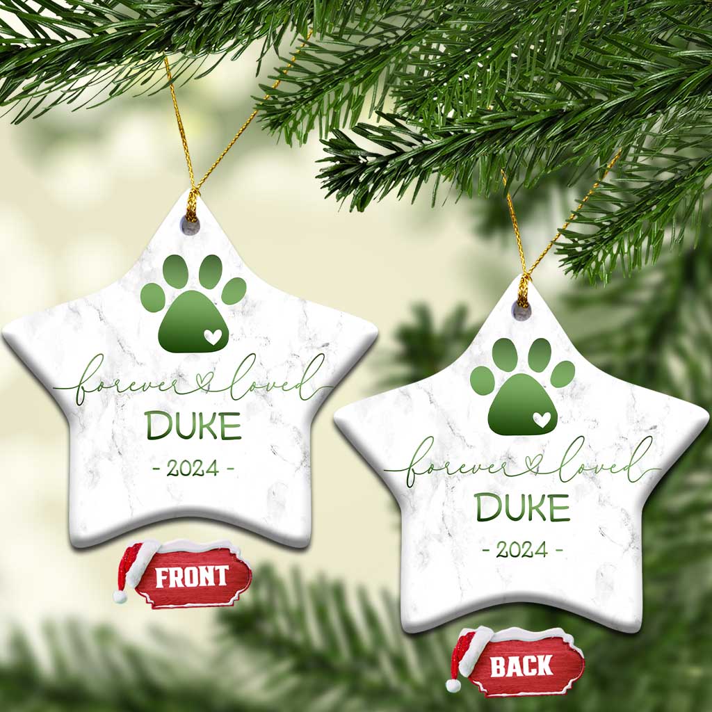 Pair of star-shaped marble pet memorial ornaments with green paw-heart, DURE, 2024