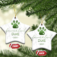 Pair of star-shaped marble pet memorial ornaments with green paw-heart, DURE, 2024