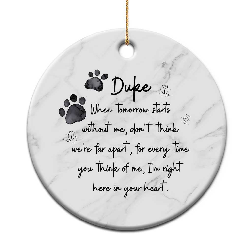 Personalized pet memorial ornament, round white marble-effect with name Duke and paw prints