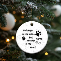 Marble white round dog memorial ornament hanging on a tree branch with paw and Name