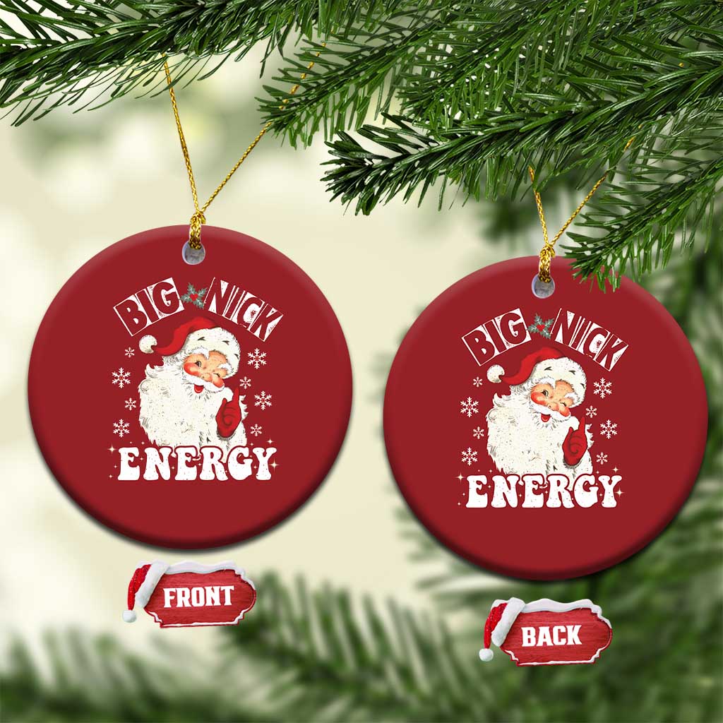 Set of two red round Santa Christmas ornaments with “Big Nick Energy” text and gold hooks