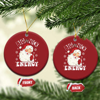 Set of two red round Santa Christmas ornaments with “Big Nick Energy” text and gold hooks