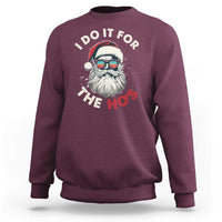Maroon Christmas sweatshirt with Santa graphic and “I Do It For The Ho’s” text on chest